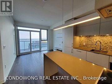 Toronto (Waterfront Communities) condo for rent - A kitchen with a countertop and sink is shown in the image.