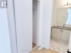 Barrie apartment for rent - A bathroom with a sink, mirror, and cabinets.