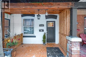 Toronto (Dovercourt-Wallace Emerson-Junction) townhouse for rent - A small porch with a black door and a brick pillar.
