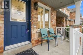 Milton (Be Beaty) townhouse for rent - A blue door with a glass window and a sign that says REALTOR.