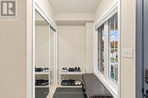 Milton (Be Beaty) townhouse for rent - A room with a bench and a pair of shoes on it.