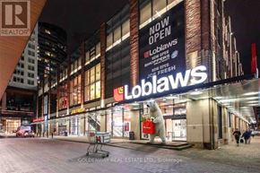 Toronto (Waterfront Communities) condo for rent - A large Loblaws store sign is lit up at night.