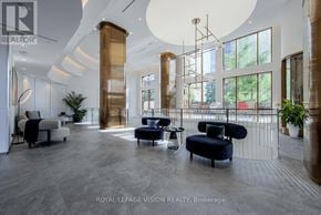 Toronto (Waterfront Communities) condo for rent - A spacious waiting area with a mix of seating options including a sofa, armchairs, and a chaise lounge.