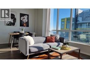 Burnaby apartment for rent - A living room with a grey couch and a coffee table.