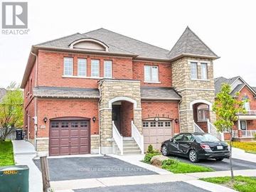 Mississauga (Meadowvale Village) apartment for rent - A brick house with a car parked in front.