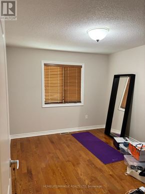 Mississauga (Meadowvale Village) apartment for rent - A room with a purple yoga mat on the floor.