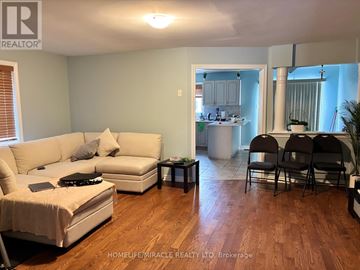 Mississauga (Meadowvale Village) apartment for rent - A living room with a white couch and a coffee table.
