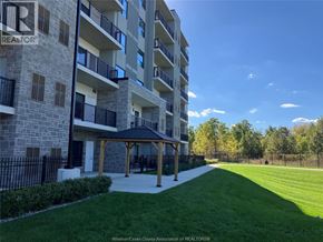 Windsor condo for rent - A large apartment complex with a gazebo in the front yard.