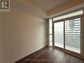 Vaughan (Vaughan Corporate Centre) condo for rent - A room with a sliding glass door leading to a balcony.