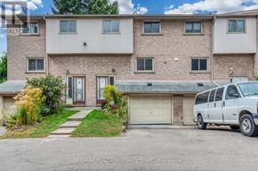 Hamilton (Beasley) townhouse for rent - A white van is parked in front of a two-story building.