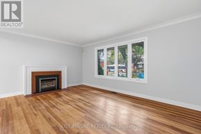 Ottawa apartment for rent - A room with a fireplace and a poster on the wall.