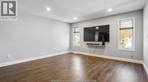 Lasalle apartment for rent - A spacious room with a television and a window.