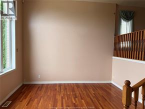 Windsor apartment for rent - A room with wooden floors and a staircase.