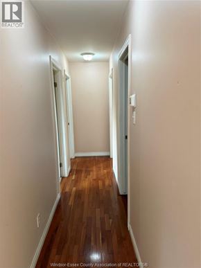 Windsor apartment for rent - A hallway with wood floors and white walls.