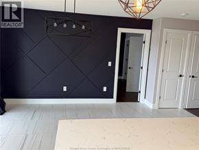 Lakeshore townhouse for rent - A room with a white marble floor and a black wall with a diamond pattern.