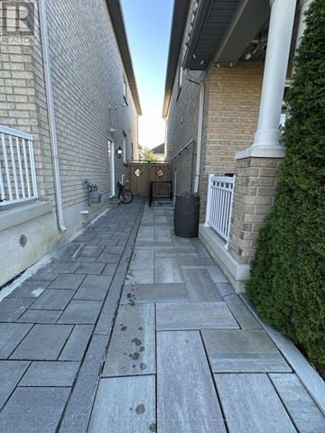 Newmarket (Woodland Hill) apartment for rent - A concrete walkway leads to a gate with a metal railing on either side.