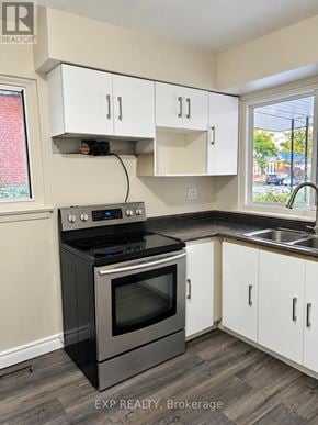 Toronto (Bendale) apartment for rent - A kitchen with a stove and cabinets.