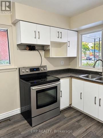 Toronto (Bendale) apartment for rent - A kitchen with a stove and cabinets.