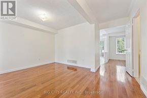 Ajax (South East) apartment for rent - A room with wooden flooring and white walls, with a door on the right side.