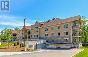 Centre Wellington (Elora/Salem) condo for rent - A large, multi-story residential building with a mix of stone and siding exterior.