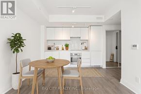Toronto (Leaside) condo for rent - A dining room with a table and chairs and a plant.