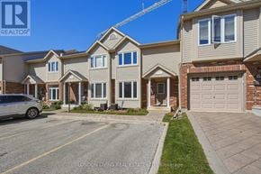 London East (East D) townhouse for rent - A row of houses with a car parked in front of them.