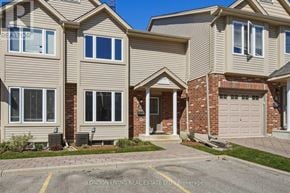 London East (East D) townhouse for rent - A row of houses with the front of one visible showing a white door and steps leading up to it.