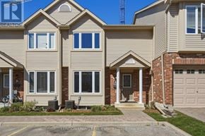 London East (East D) townhouse for rent - A two-story house with a garage is for sale.