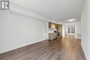 Toronto (Humber Heights) condo for rent - A spacious room with wooden flooring and white walls.