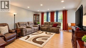 Kitchener apartment for rent - A living room with brown furniture and a rug.