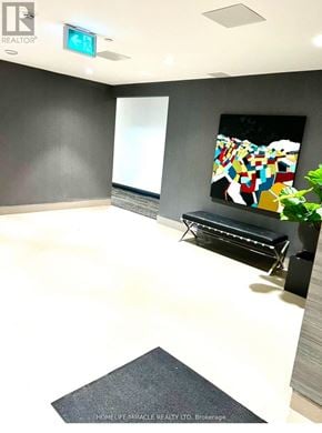 Milton (Walker) condo for rent - A room with a bench and a painting on the wall.