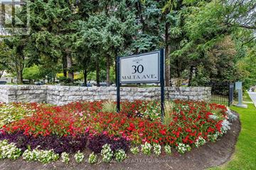 Brampton (Fletcher's Creek South) condo for rent - A sign for 30 MALTA AVE. is in front of a flower bed.