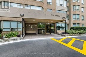 Brampton (Fletcher's Creek South) condo for rent - The front of a building with the sign "Imperial" on it.