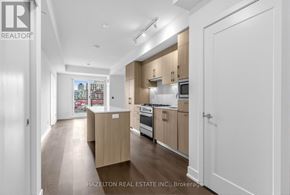 Toronto (Yonge-Eglinton) condo for rent - A modern kitchen with wooden cabinets and appliances.