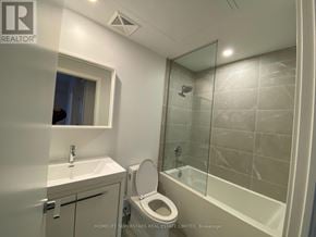 Vaughan (Vaughan Corporate Centre) condo for rent - A bathroom with a toilet, sink, and shower.