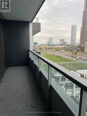 Vaughan (Vaughan Corporate Centre) condo for rent - A balcony with a view of a cityscape and construction site.