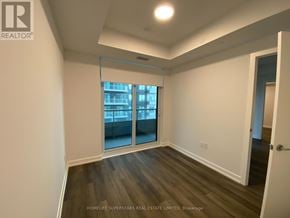 Vaughan (Vaughan Corporate Centre) condo for rent - A room with a sliding glass door leading to a balcony.