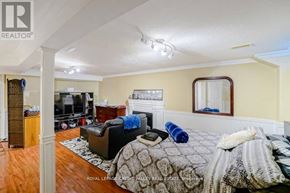 Brampton (Fletcher's West) apartment for rent - A bedroom with a bed, couch, and television.