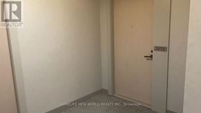Vaughan (Vaughan Corporate Centre) condo for rent - A white door with a black handle in a white room.