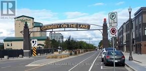 Grimsby (Grimsby Beach) condo for rent - A street view of Grimsby on the Lake with a car driving down the road.