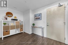 Grimsby (Grimsby Beach) condo for rent - A room with a white wall and a brown door.