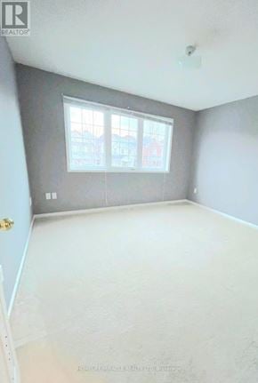 Oshawa (Pinecrest) apartment for rent - A room with a door and a window.