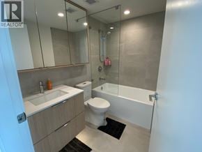 Burnaby apartment for rent - A bathroom with a toilet, sink, and bathtub.
