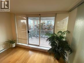 Vancouver apartment for rent - A room with a large window and a plant.