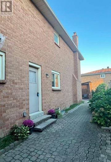 Richmond Hill (Doncrest) apartment for rent - A brick house with a white door and windows.