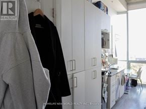 Oshawa (Samac) condo for rent - A grey hoodie hanging on a white door in a room.