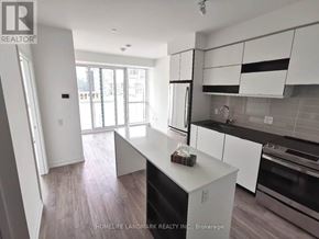 Mississauga (City Centre) condo for rent - A kitchen with white cabinets and a black dishwasher.