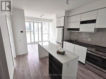 Mississauga (City Centre) condo for rent - A kitchen with white cabinets and a black dishwasher.