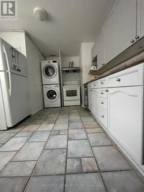 Aurora (Aurora Highlands) apartment for rent - A laundry room with a washer and dryer stacked on top of each other.