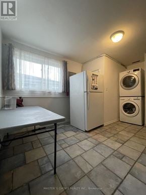 Aurora (Aurora Highlands) apartment for rent - A laundry room with a washer and dryer.